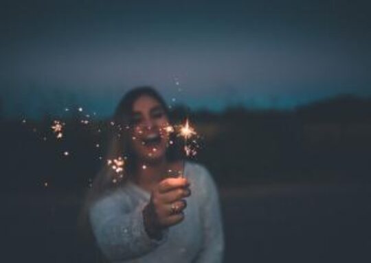 Woman holding sparklers