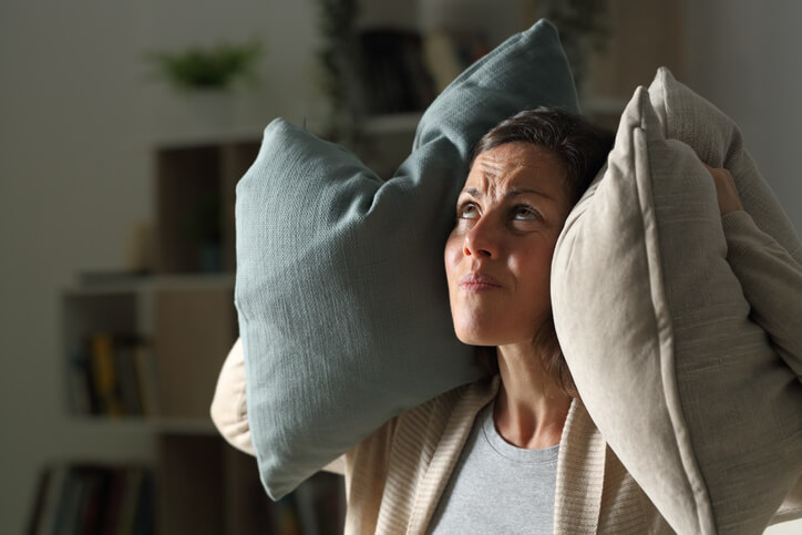 Woman With Noisy Neighbor